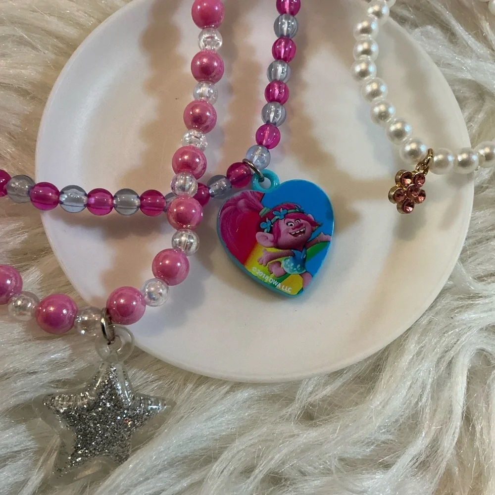 2 necklaces (one Dreamworks Trolls/Poppy) and 2 bracelets for children